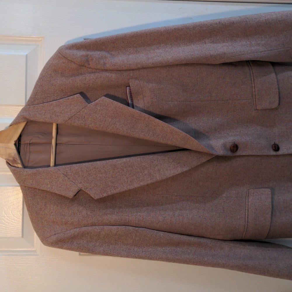 Suit coat. 42R. Polyester and wool. Rose color with herringbone pattern.